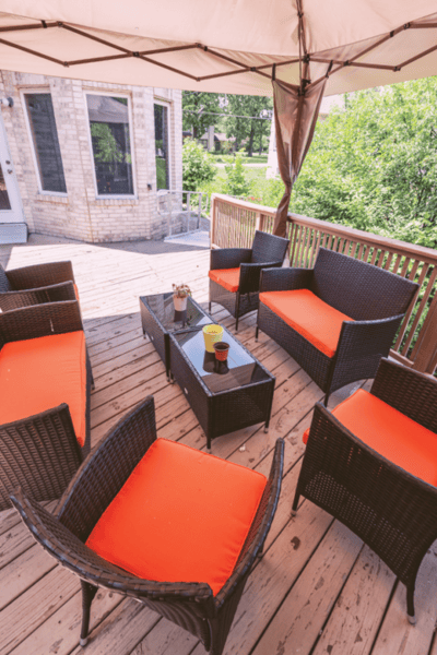 Outdoor seating area with orange cushions