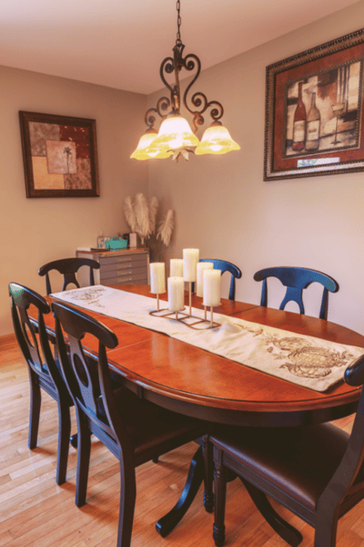 Cozy dining area with a wooden table and candles