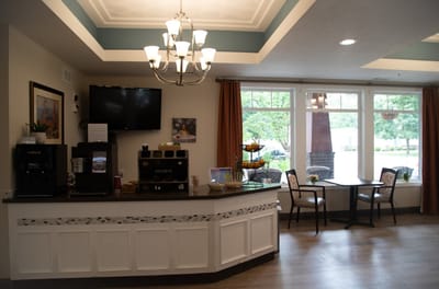 Bright common area with coffee station and seating