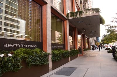 Exterior view of Inspīr Carnegie Hill with signage