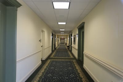 A hallway featuring rooms in the facility