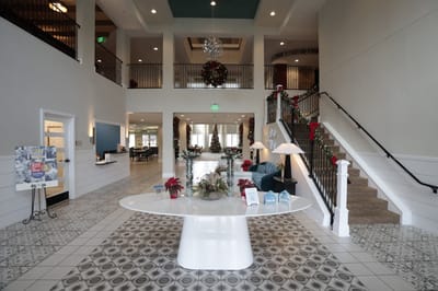 Bright interior of a decorated common area with seating