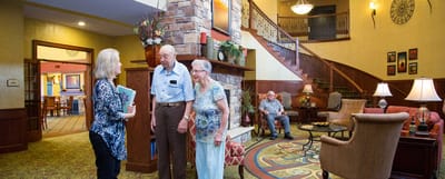 Residents and staff interacting in a common area