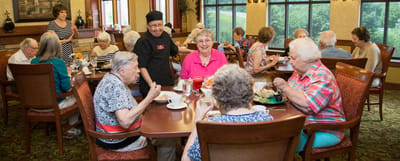 Residents enjoying a meal in the dining room