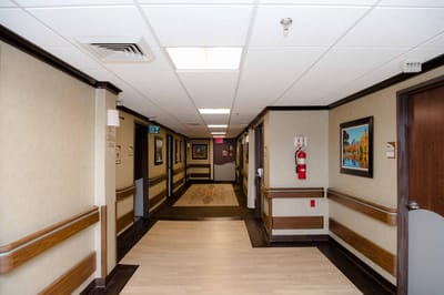 Interior hallway with artwork and emergency equipment