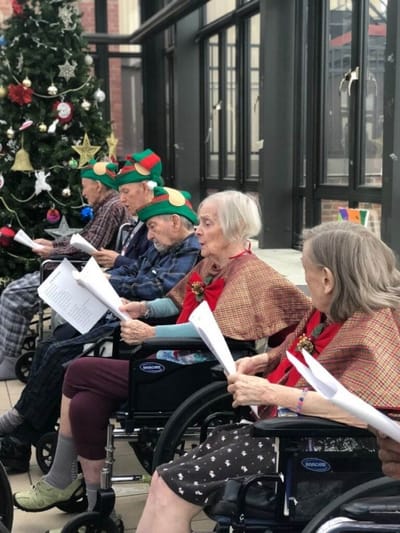 Residents participating in a holiday sing-along