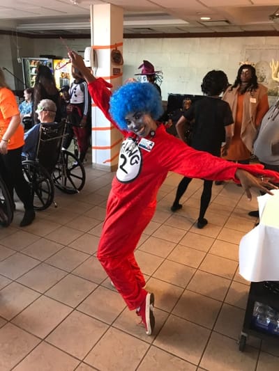 Staff member in costume at a festive event