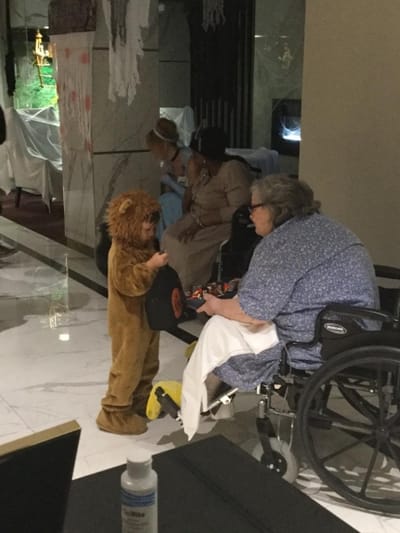 Resident interacting with a child in a common area
