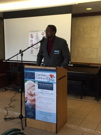 Speaker addressing attendees at a community event