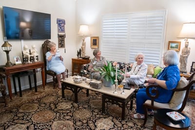 Residents socializing in a cozy common area