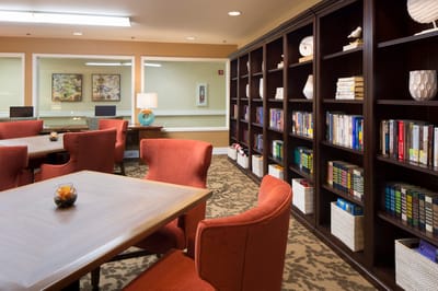 Bright common area with bookshelves and seating
