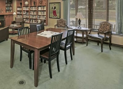 Cozy common area with seating and bookshelves