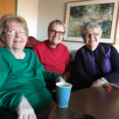 Three residents enjoying time together in a common area
