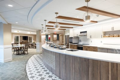 Modern dining area with kitchen and seating