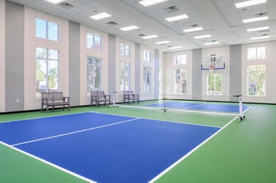 Indoor sports area with courts and seating
