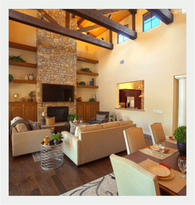 Bright interior common area with stone fireplace