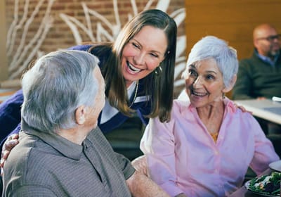 Acacia Health Center at Sagewood, Nursing Home in Phoenix, AZ — Residents enjoying conversation with a staff member