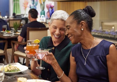 Acacia Health Center at Sagewood, Nursing Home in Phoenix, AZ — Two women toasting with cocktails at a dining table