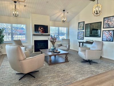 Cozy common area with a fireplace and seating