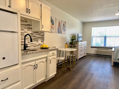 Bright interior of a resident unit with kitchenette