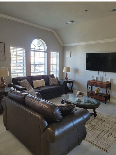 Cozy common area with seating and a TV