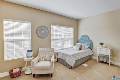 Cozy resident room with a bed and seating area