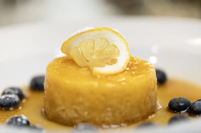 Dessert of lemon pudding with blueberries