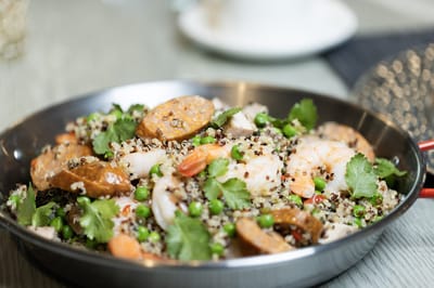 Colorful seafood quinoa dish on a plate