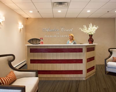Reception area with staff member at the front desk