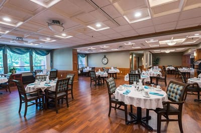 Bright dining room with tables set for meals