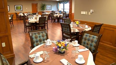 Well-set dining room with tables prepared for guests