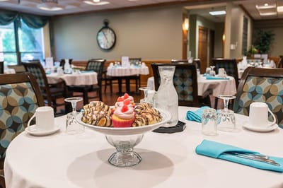 Dining area with desserts on the table