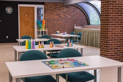 Activity room with tables set for crafts and games