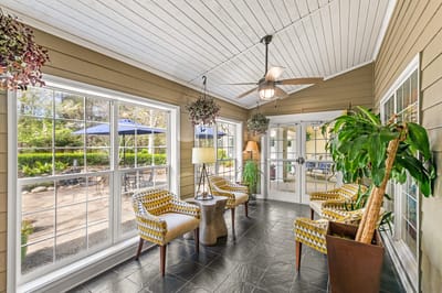 Bright common area with seating and outdoor views