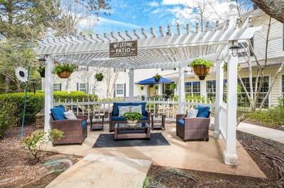Outdoor patio area with seating and plants