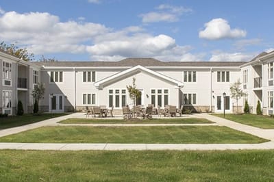 Outdoor space with seating area in front of the building