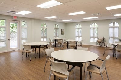 Interior common area with tables and chairs