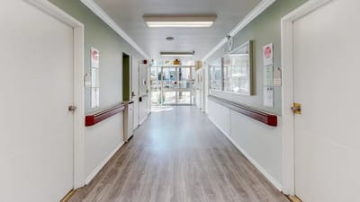 Bright hallway leading to the facility entrance