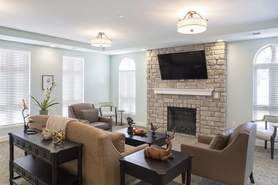 Cozy common area with seating and a fireplace