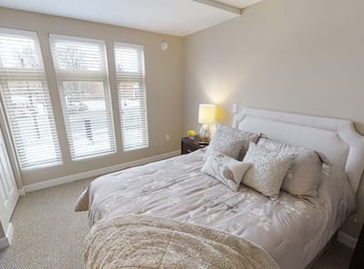 Cozy resident room with a bed and natural light