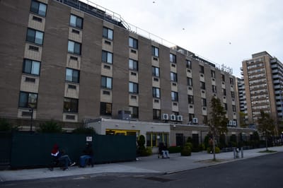 Exterior view of Oceanview Manor with people seated outside