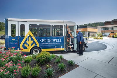 Residents boarding a Springwell facility shuttle bus
