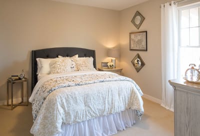 Well-decorated private bedroom with soft lighting