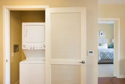 Laundry area with washer and dryer in a residential room