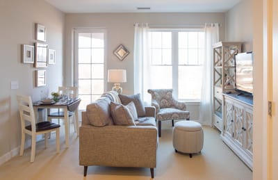 Springwell Senior Living Community, assisted living in Baltimore, MD — Cozy living room with a sofa and dining area