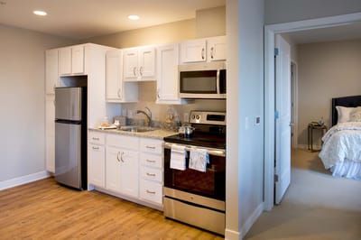 Interior view of a senior living kitchen with modern appliances