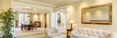 Bright and inviting common area with seating and dining