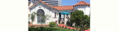 Exterior view of Miracle Mile Manor with garden area