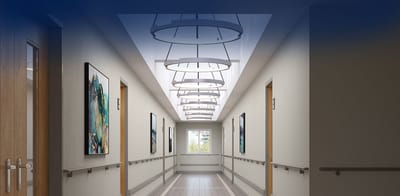 Well-lit hallway with modern lighting and artwork