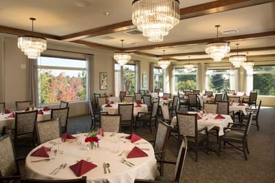 Elegant dining room with tables set for a meal